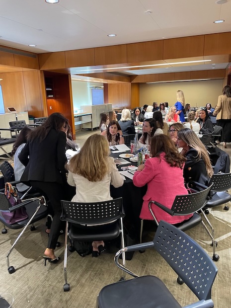 Luxury Women Leaders Summit delegates comparing notes and discussing takeaways that stood out