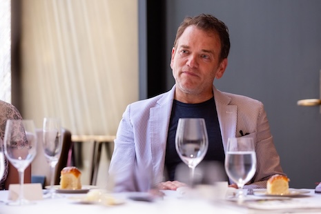 Douglas Elliman's Scott Durkin is all ears at the Heesen Yachts x Luxury Roundtable Luncheon June 19