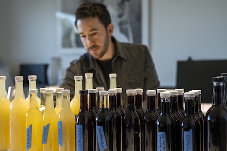 Jesse Katz examining product in the harvest cellar. Photo by Rachid Dahnoun