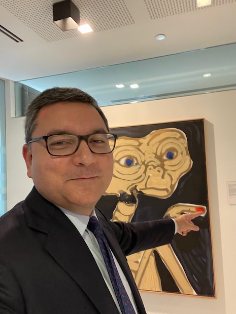 Luxury Roundtable's Mickey ALAM KHAN connecting with the art on UBS venue walls